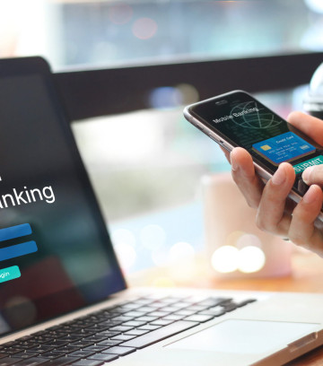 Man using online banking with credit card on touch screen device. Mobile banking. Digital and internet payments shopping on network. All on screen and credit card are designed up.